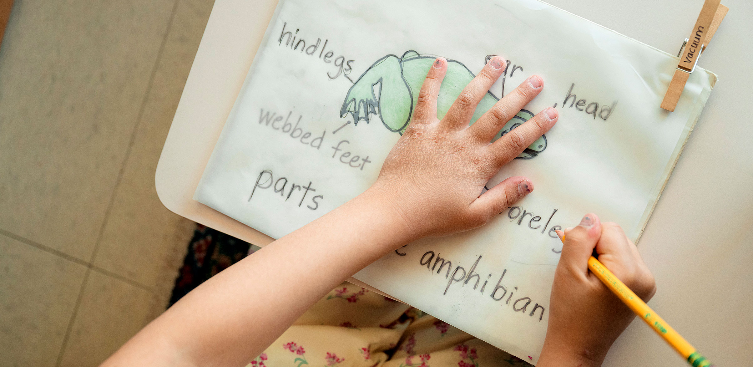 A girl practices writing.